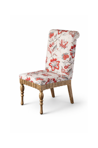 Chair with floral patterned fabric.