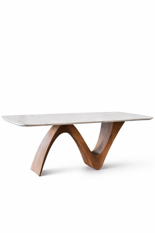 Modern coffee table with a white marble top and wooden legs on a white background
