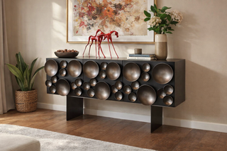 Decorative console table with spherical design in a living room setting
