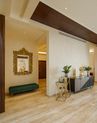 Modern interior design with a mirror, bench, and decorative items.