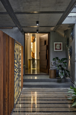 Modern interior hallway with decorative elements and a wooden door.
