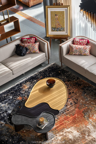 Modern living room with a stylish coffee table and decorative pillows.