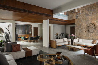 Modern living room with stylish furniture and decorative elements.