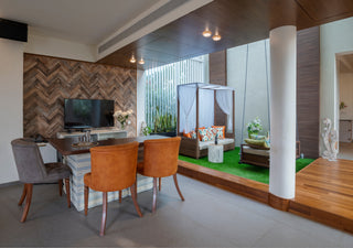Modern living room with a dining area and a small outdoor area.