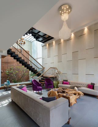 Modern living room with a staircase in the background