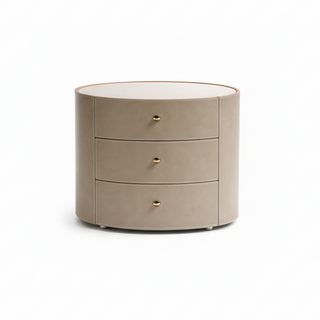 Round beige dresser with three drawers on a white background